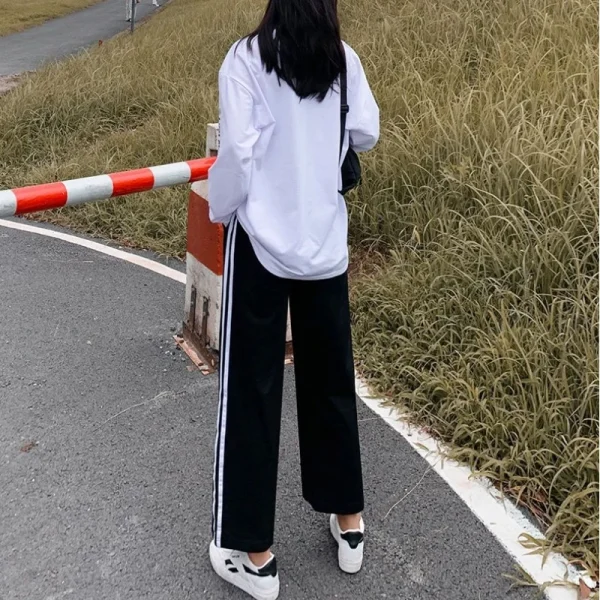 Pantaloni sportivi a gamba larga patchwork a righe in vita elastica stile preppy Pantaloni dritti casual primavera autunno Abbigliamento donna di moda 3