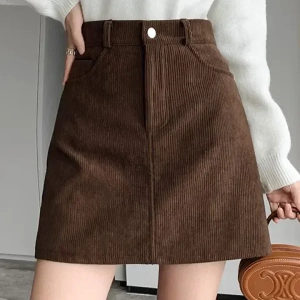 Minigonna a trapezio in velluto a coste alla moda per le donne Gonne corte a vita alta dimagranti Gonne a mezza lunghezza alla moda Decorazioni in puro colore 2