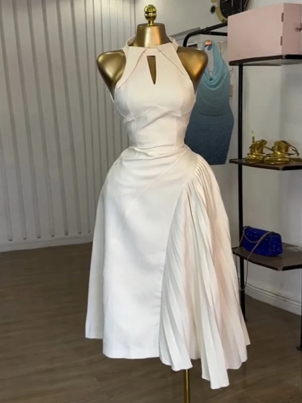 Abiti midi alla moda senza maniche da donna con pieghe asimmetriche e scavate, perfetti per cocktail party o invitati al matrimonio 1