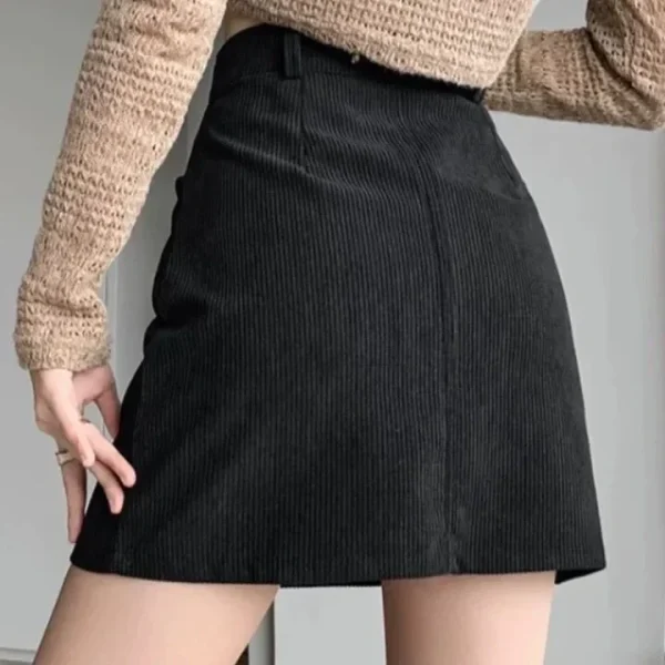 Minigonna a trapezio in velluto a coste alla moda per le donne Gonne corte a vita alta dimagranti Gonne a mezza lunghezza alla moda Decorazioni in puro colore 4