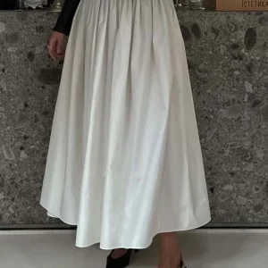 Oymimi Moda Gonna da donna in cotone bianco Elegante gonna a pieghe con lacci allentata Casual Nuove gonne a metà polpaccio solide Abbigliamento femminile 1